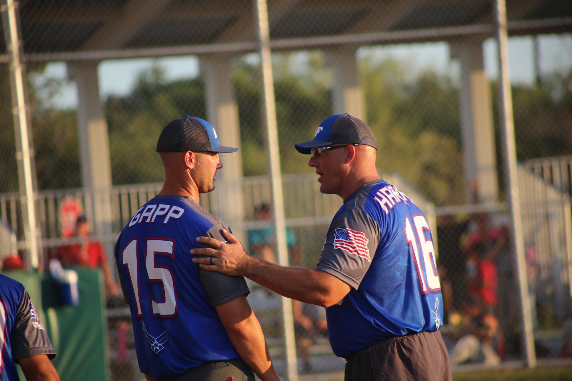 Staff Sgt. Garrett Gapp, 36th Maintenance Squadron, NCO in charge of maintenance flight, (left) and Chief Master Sgt. Scott Harris, Headquarters, Air Education and Training Command first sergeant have a pre-game discussion Sept. 20, 2016 at Joint Base Lackland-San Antonio, Texas. Gapp was selected as a member of the All-Air Force Men’s Slow Pitch Softball Team playing the position of first basemen. (Courtesy Photo)