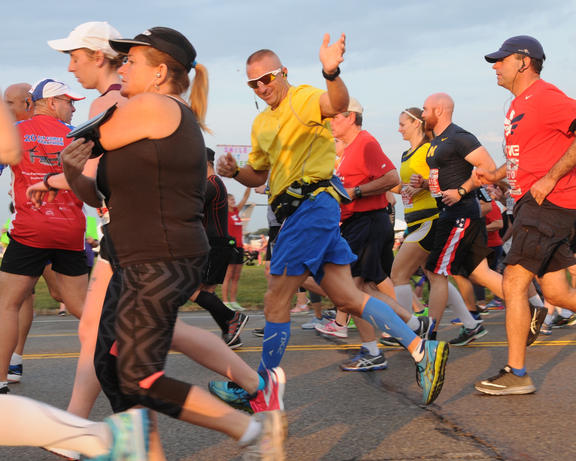 Maj. Michael Loy, center, Montana Air National Guard member,  waves from the start of the 20th anniversary U. S. Air Force Marathon at Wright-Patterson Air Force Base, Ohio, Sept. 17, 2016. Loy coordinated a team from the Montana National Guard and Malmstrom Air Force Base to participate in the event. (U.S. Air National Guard photo/Staff Sgt. Lindsey Soulsby)