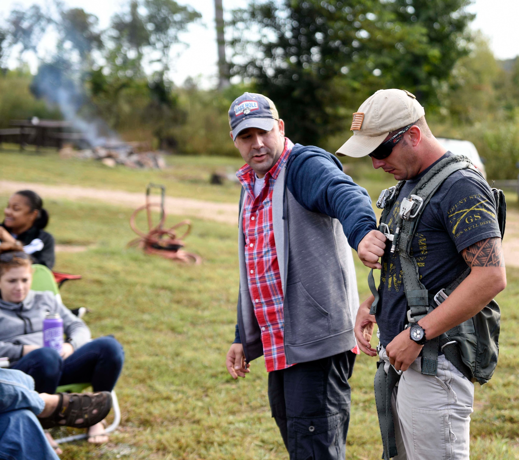 Tech. Sgt. Andrew Stoll, the 189th Operations Support Squadron aircrew flight equipment flight chief, demonstrates the proper wear of a hanging harness during ground training Oct.1, 2016, at Lake Ouachita, Arkansas. The two-day training event consisted of aircrew flight equipment training, water survival training and self-aid buddy care. (U.S. Air National Guard photo by Tech. Sgt. Jessica Condit)