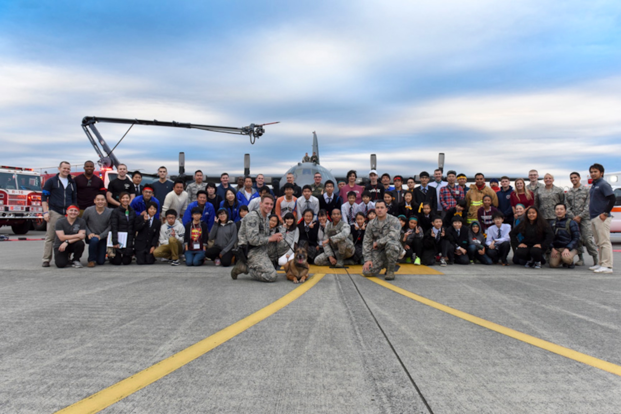 Attendees pose for a photo during the Youth international Exchange Fair at Yokota Air Base, Japan, Oct. 29, 2016. The fair hosted by the Yokota Company Grade Officers Council and Junior Chamber International Japan to foster interaction between Japanese and Yokota children. Approximately thirty students from Yokota and Tachikawa, Japan participated in the event, included a base tour, a workshop on the United Nation Global Goals for Sustainable Development and trick‐or-treating. (U.S. Air Force photo by Machiko Arita/Released)