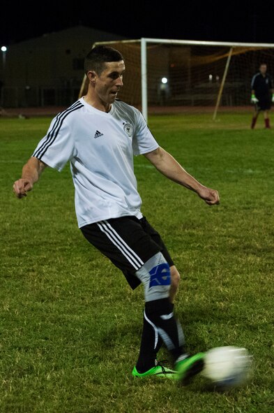 A member of the NATO intramural soccer team kicks a ball Nov. 1, 2016, at Incirlik Air Base, Turkey. The NATO team was comprised of German soldiers on the German deployment COUNTER DAESH. (U.S. Air Force photo by Airman 1st Class Devin M. Rumbaugh)