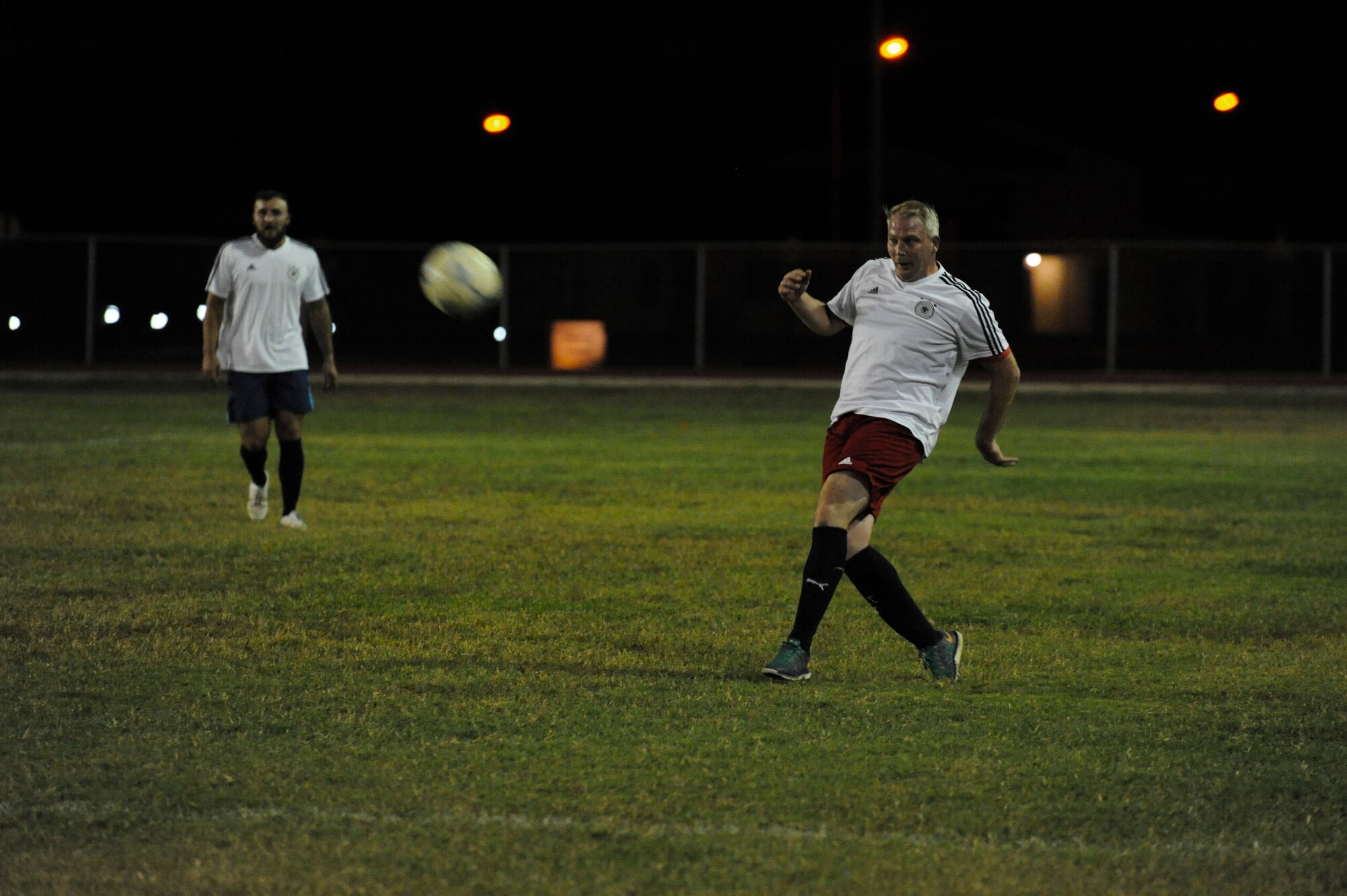 A member of the NATO intramural soccer team kicks a ball Nov. 1, 2016, at Incirlik Air Base, Turkey. The NATO team won the championship game in a five-round shootout. (U.S. Air Force photo by Airman 1st Class Devin M. Rumbaugh)
