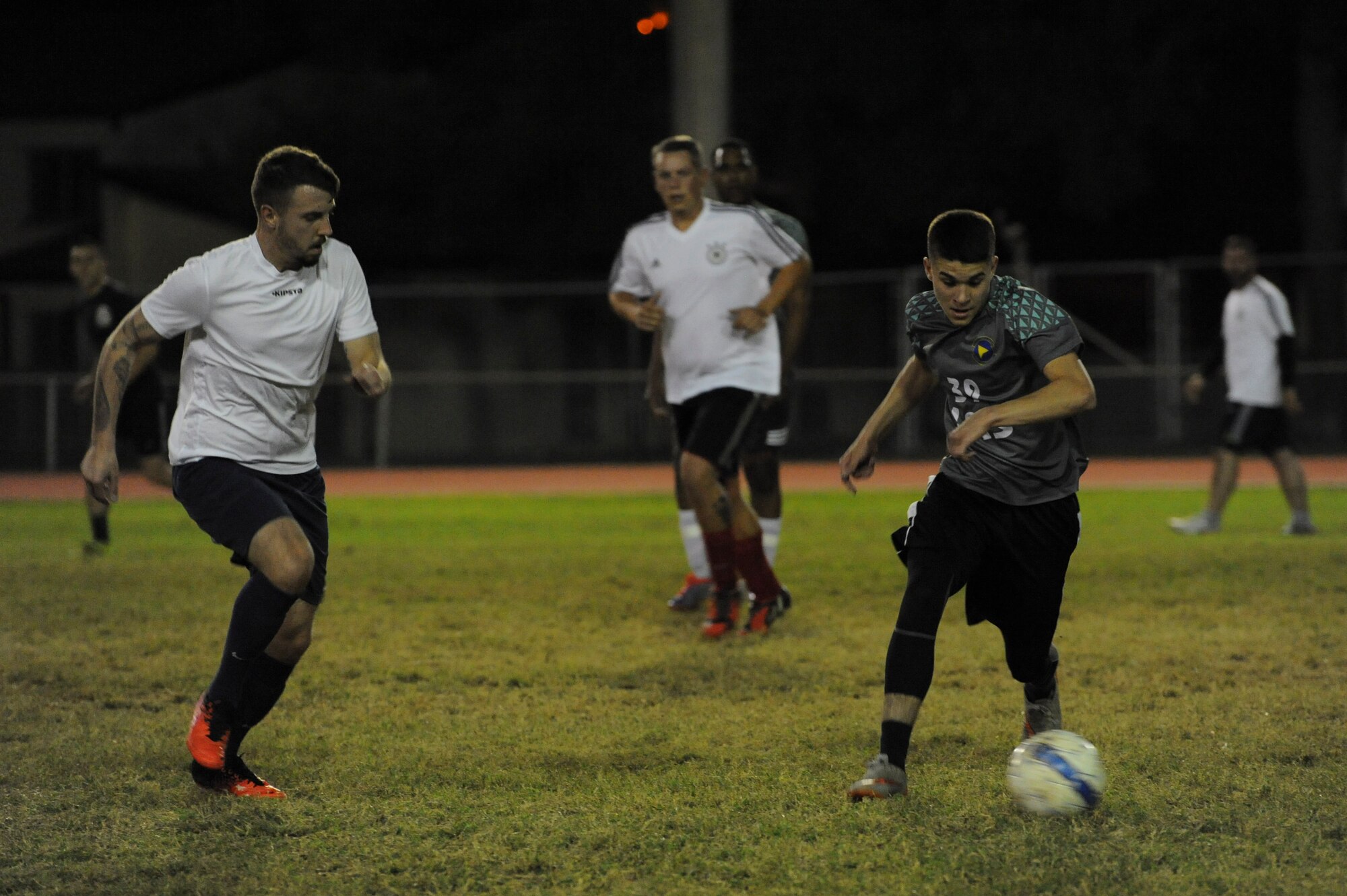 Members of the 39th LRS and NATO intramural soccer teams chase after a loose ball Nov. 1, 2016, at Incirlik Air Base, Turkey. The 39th LRS fell to NATO after a 3-5 shootout loss. (U.S. Air Force photo by Airman 1st Class Devin M. Rumbaugh)