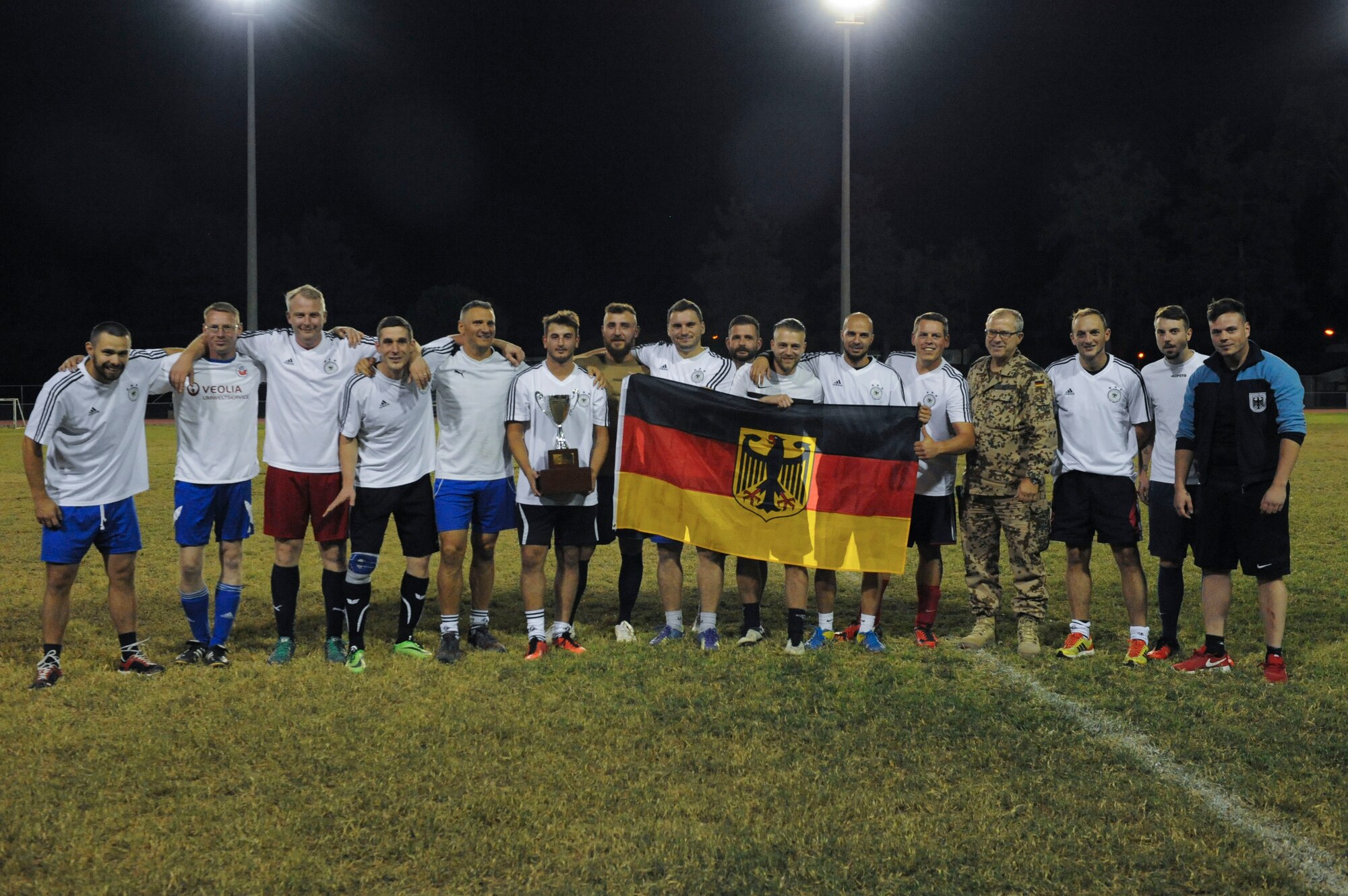 The NATO intramural soccer team stands with the championship trophy Nov. 1, 2016, at Incirlik Air Base, Turkey. The NATO team was the number one seed for the championship and won after a shootout. (U.S. Air Force photo by Airman 1st Class Devin M. Rumbaugh)