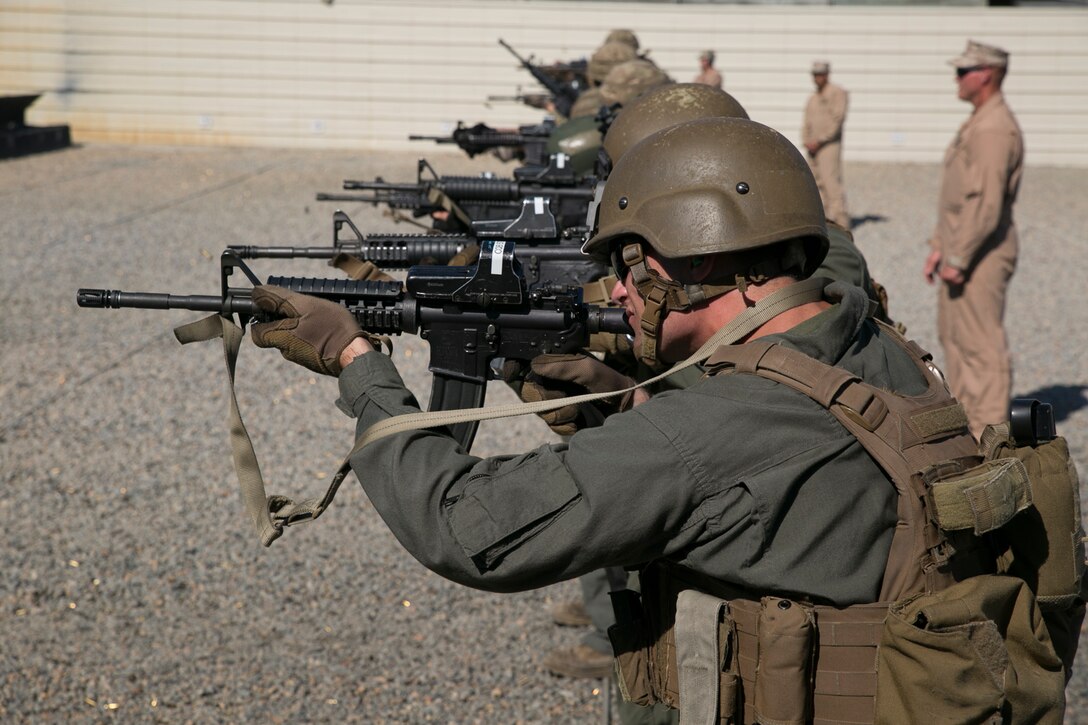 U.S. Marines and sailors from Marine Corps Security Force Battalions Bangor, Wa., and Kings Bay, Ga., and 43 Fleet Protection Group Royal Marines fire at their targets during a movement-to-contact drill during Exercise Tartan Eagle 16 Phase II, aboard Naval Support Activity Northwest Annex, Chesapeake, Va., Oct 19. Marines, sailors and Royal spent the first week of Phase II sharpening their marksmanship skills with stress shoots, firing at multiple targets, speed drills and firing from modified positions. (Official U.S. Marine Corps photo by Sgt. Calvin Shamoon/ Released)