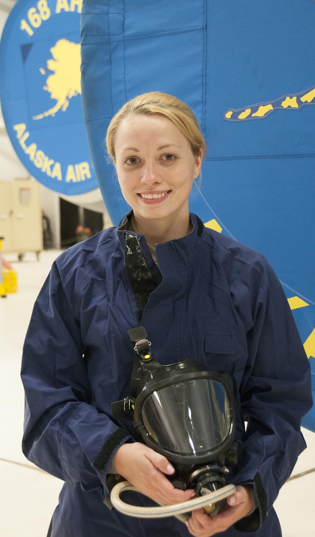 Staff Sgt. Julia Meyer, a fuels systems mechanic with the 168th Maintenance Squadron, holds her respirator while dressed in waterproof overalls inside the units fuel cell at Eielson AFB, Alaska, October 18, 2016. Meyer is a fulltime technician with the Interior-Alaska unit and was recognized for her outstanding technical abilities during a recent deployment to Southwest Asia. 