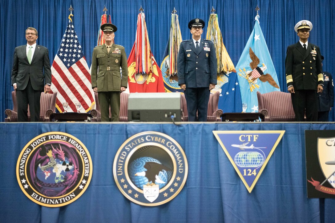 From left, Defense Secretary Ash Carter and Marine Corps Gen. Joe Dunford, chairman of the Joint Chiefs of Staff, host the U.S. Strategic Command change-of-command ceremony at Offutt Air Force Base, Neb., Nov. 3, 2016. Air Force Gen. John E. Hyten assumed command from Navy Adm. Cecil D. Haney. DoD photo by Navy Petty Officer 2nd Class Dominique A. Pineiro