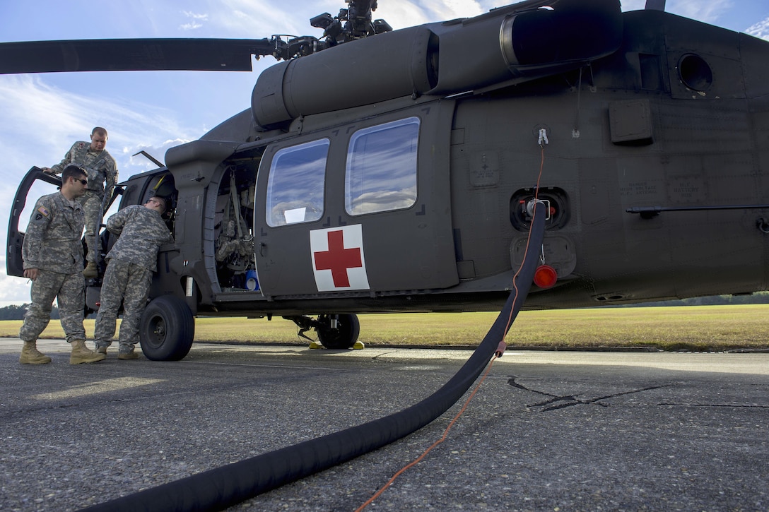 Soldiers refuel a UH-60 Black Hawk helicopter during Southern Strike 17 at Camp Shelby Joint Forces Training Center, Miss., Oct. 26, 2016. Air Force photo by Airman 1st Class Sean Carnes
