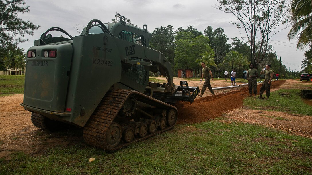 U.S. Marines from Special Purpose Marine Air-Ground Task Force - Southern Command and Honduran soldiers from Fifth Infantry Battalion work to install a new pipeline that will provide water throughout the Fuerte Mocoron base in Mocoron, Honduras, Sept. 6, 2016. U.S. Marines and Sailors assigned to Special Purpose Marine Air-Ground Task Force-Southern Command participated in engineering projects, security cooperation and disaster relief preparation in Belize, El Salvador, Guatemala and Honduras. 