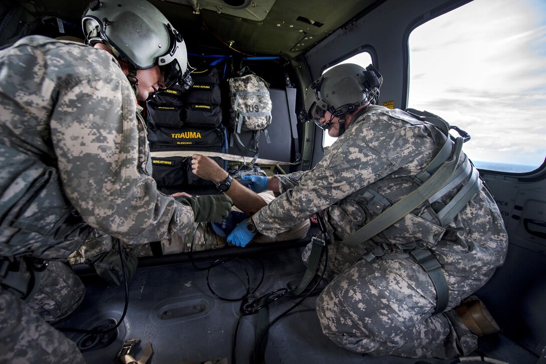 Army Sgt. Bradon Smith, right, helps Sgt. Rickie Smith take vital signs on a role player acting as a patient during a medical evacuation scenario for Southern Strike 17 at Camp Shelby Joint Forces Training Center, Miss., Oct. 26, 2016. Bradon Smith is a crew chief and Rickie Smith is a flight medic assigned to the Mississippi Army National Guard’s Golf Company, 1st Battalion, 168th Aviation Regiment. Air Force photo by Airman 1st Class Sean Carnes