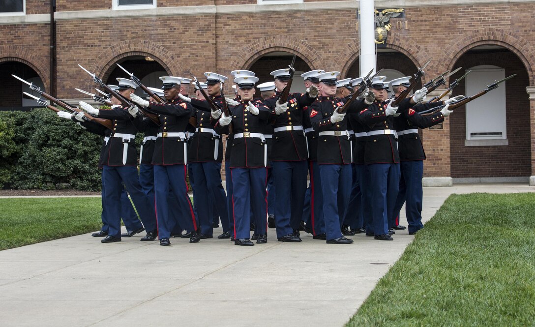 The United States Marine Corps Silent Drill Platoon performs the “bursting bomb” during the Tun Tavern II event at Marine Barracks Washington, D.C, Nov. 1, 2016. Tun Tavern II is a celebration of the Marine Corps' birthday hosted for active and retired FBI Agents each year, all of whom are retired Marines.(Official Marine Corps photo by Lance Cpl. Robert Knapp/Released)