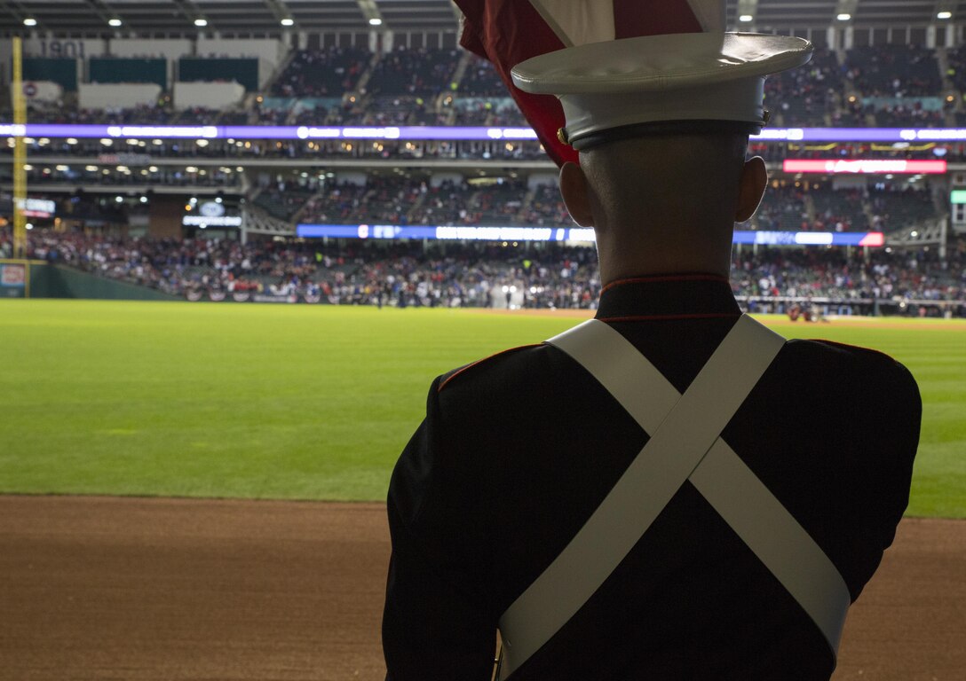 Marines from 3rd Battalion, 25th Marine Regiment, 4th Marine Division, participated in a Color Guard ceremony at game one of the 2016 World Series at Progressive Field in Cleveland, Oct. 25, 2016. Sgt. Christopher Sprouse, the data chief for 3/25, holds the American flag in anticipation for stepping out in front of a stadium holding over 30,000 spectators. Just before the ceremony, announcer Bob Tyek gave credit to the Marine Corps Reserve and its 100 years of faithful service. Today, approximately 500 Reserve Marines are providing fully integrate global operational support to the Fleet and Combatant Commanders. For more information on the history and heritage of the Marine Corps Reserve as well as current Marine stories and upcoming Centennial events, please visit www.marines.mil/usmcr100. (U.S. Marine Corps photo by Lance Cpl. Dallas Johnson)