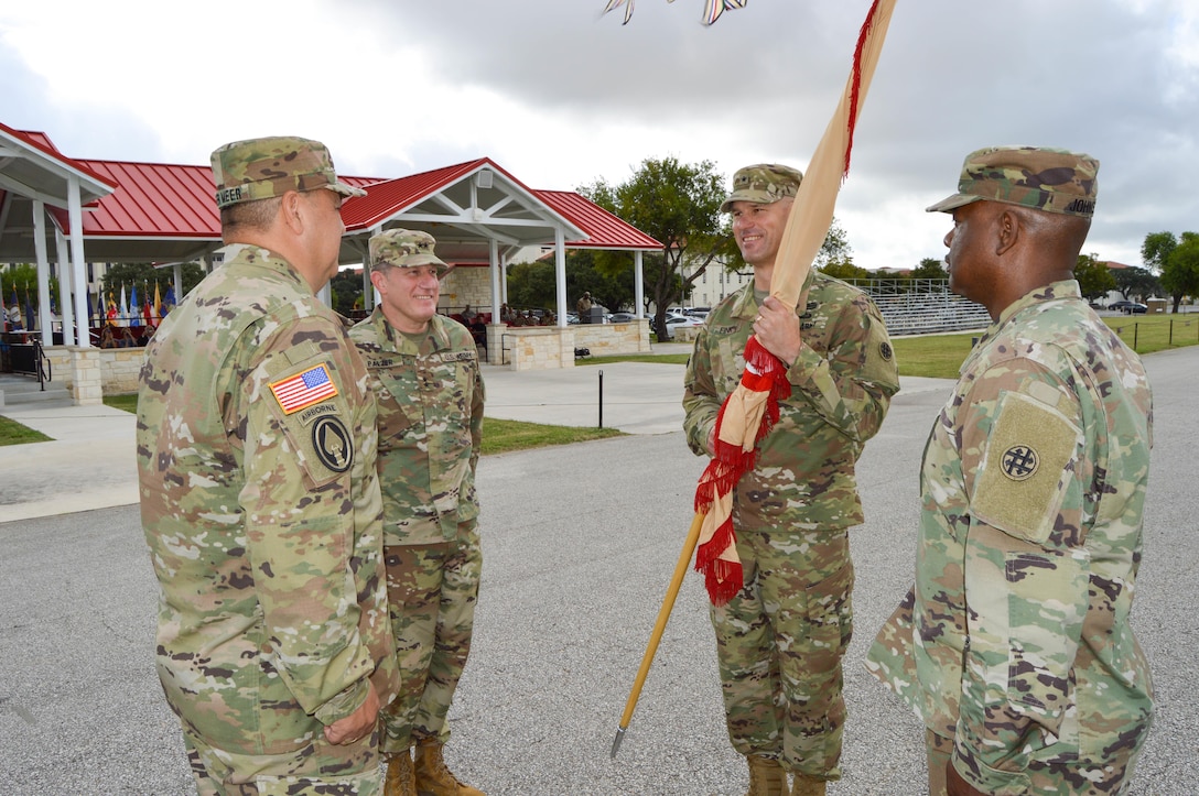 Brig. Gen Alex Fink, the incoming commander for the 4th Sustainment Command (Expeditionary), holds the unit's colors during a change of command ceremony held at Fort Sam Houston, Texas, on Oct. 15, 2016.  Maj. Gen. Mark Palzer, the 79th Sustainment Support Command commanding general; Col. Herman Ter Meer, the outgoing commander; and Command Sgt. Maj. Larry D. Johnson participated with Brig. Gen Fink in a traditional passing of the unit's colors as a part of the ceremony.  (U.S. Army Photo by Spc. Eddie Serra)