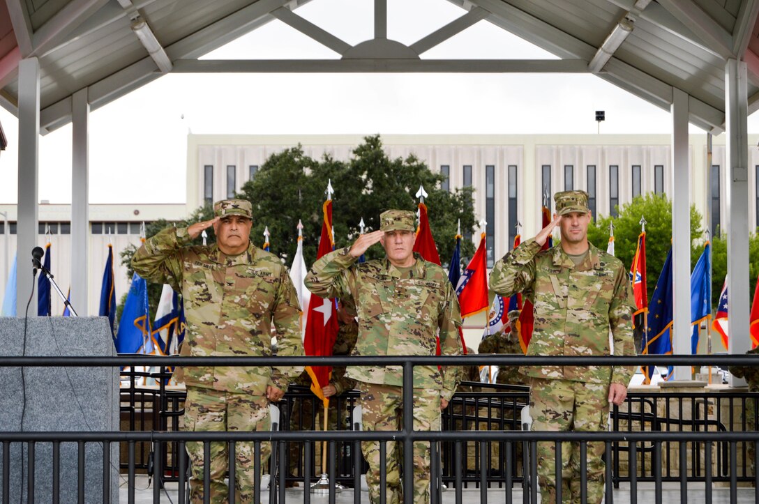 Maj. Gen Mark Palzer (center), Brig. Gen. Alex Fink (right) and Col. Herman Ter Meer (left) render honors during the playing of the national anthem at the 4th Sustainment Command (Expeditionary) change of command ceremony held at Fort Sam Houston, Texas, on Oct. 15, 2016.  (U.S. Army Photo by Spc. Eddie Serra)