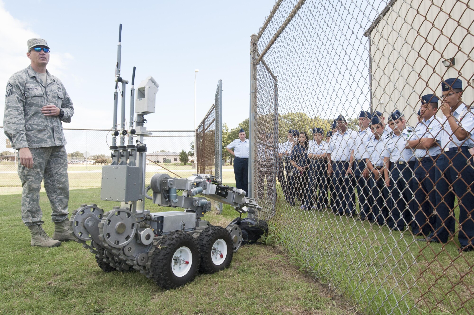 Senior Master Sgt. Daniel Montrose, 301st Civil Engineer Squadron's Explosive Ordnance Disposal superintendent, explains why high-tech robots are used to retrieve potentially hazardous items during a tour Oct. 26, 2016, at Naval Air Station Fort Worth Joint Reserve Base, Texas. Cadets also visited the 301st Maintenance Group where they saw F-16 Fighting Falcon weapons and engines. They also toured the Navy’s control tower and radar room. (U.S. Air Force photo by Julie Briden-Garcia)