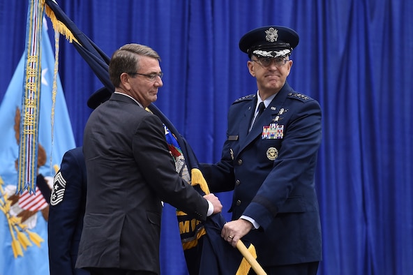 Gen. John E. Hyten, accepts the command guidon from Secretary of Defense Ash Carter as he takes command of U.S. Strategic Command during a ceremony at Offutt Air Force Base, Neb., Nov. 3, 2016. Carter presided over the ceremony and provided remarks during which he congratulated Hyten on his appointment as the new STRATCOM commander. Hyten previously served as commander of Air Force Space Command. (U.S. Air Force photo/Staff Sgt. Jonathan Lovelady)