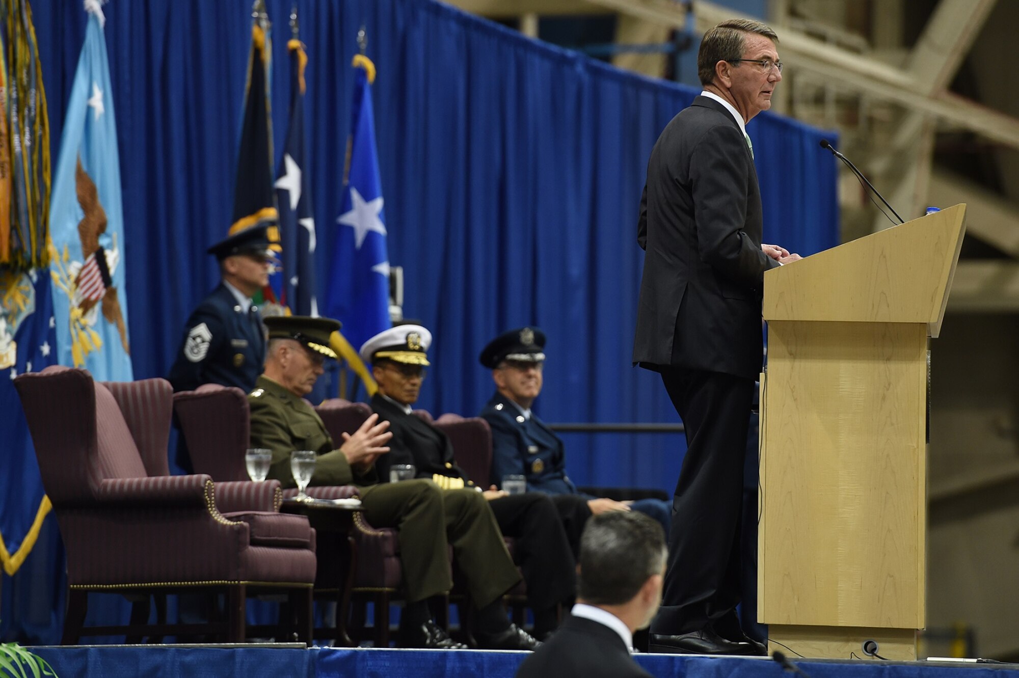 Secretary of Defense Ash Carter (right) provides remarks during the U.S. Strategic Command (USSTRATCOM) change of command ceremony at Offutt Air Force Base, Neb., Nov. 3, 2016. Carter, who presided over the change of command, congratulated Gen. John E. Hyten (seated right) on his appointment as the new USSTRATCOM commander. He also thanked Adm. Cecil D. Haney (seated center), outgoing USSTRATCOM commander, for his service. Additionally, Chairman of the Joint Chiefs of Staff Gen. Joseph F. Dunford (seated left) provided remarks during the ceremony and presented the Joint Meritorious Unit Award to USSTRATCOM. Hyten previously served as commander of Air Force Space Command, and Haney will retire from active military duty during a separate ceremony in January. One of nine DoD unified combatant commands, USSTRATCOM has global strategic missions assigned through the Unified Command Plan that include strategic deterrence; space operations; cyberspace operations; joint electronic warfare; global strike; missile defense; intelligence, surveillance and reconnaissance; combating weapons of mass destruction; and analysis and targeting. (U.S. Air Force photo by Staff Sgt. Jonathan Lovelady)