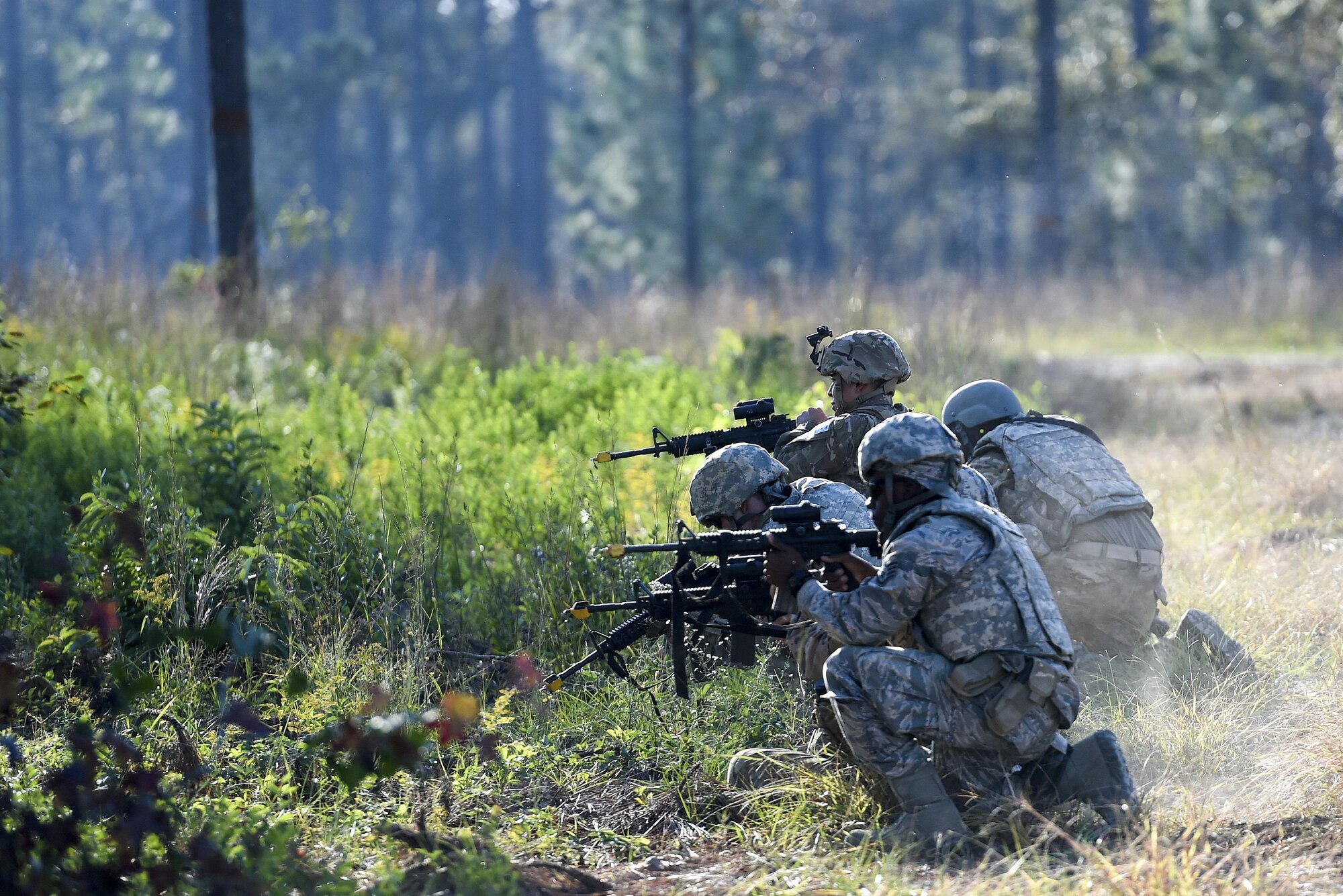Air Commandos with the 1st Special Operations Mission Support Group simulate returning fire during Task Force Exercise Southern Strike at Camp Shelby, Miss., Oct. 25, 2016. Students were evaluated on their ability to respond to a possible IED along their route, provide security while meeting with village leaders and finally - react to enemy weapons fire during their convoy’s return back to base. (U.S. Air Force photo by Senior Airman Jeff Parkinson)
