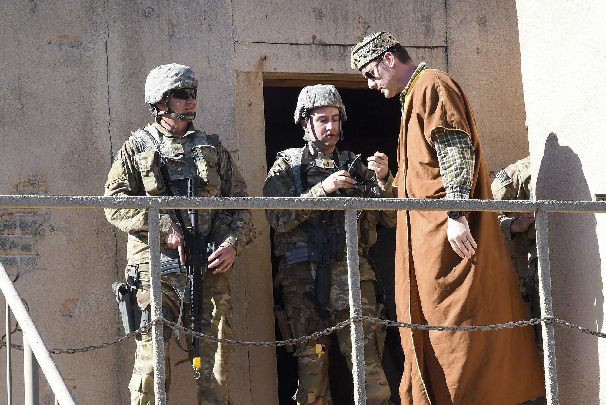Air Commandos with the 1st Special Operations Mission Support Group meet with a key leader during Task Force Exercise Southern Strike at Camp Shelby, Miss., Oct. 25, 2016. During the mission students were evaluated on their ability to respond to a possible IED along their route, provide security while meeting with village leaders and finally - react to enemy weapons fire during their convoy’s return back to base. (U.S. Air Force photo by Senior Airman Jeff Parkinson)