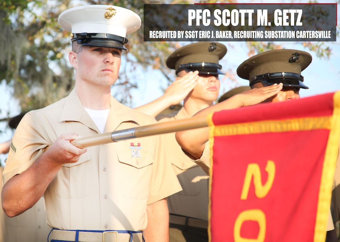 Private First Class Scott M. Getz presents his platoon's guidon before recruit graduation Nov. 4, 2016 aboard Marine Corps Recruit Depot Parris Island, South Carolina. Getz was recruited out of Recruiting Substation Cartersville by Staff Sgt. Eric J. Baker. (Official Marine Corps photo by Cpl. Diamond N. Peden/Released)
