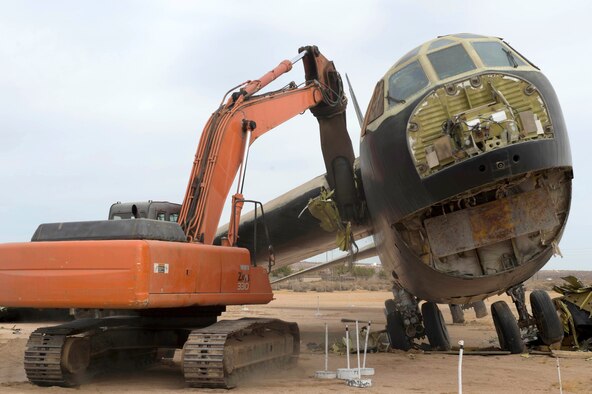 A wrecker dismantles B-52 56-0585 in front of the Air Force Flight Test Museum Oct. 27. The aircraft arrived at the AFFT Museum in 1983, and over the years the condition of the aircraft had deteriorated. Returning it to museum standards was not cost-effective. The Vietnam-era combat aircraft's dismantling will provide parts for other B-52Ds at six other aviation museums throughout the country. (U.S. Air Force photo by Joseph Pol Gocong)