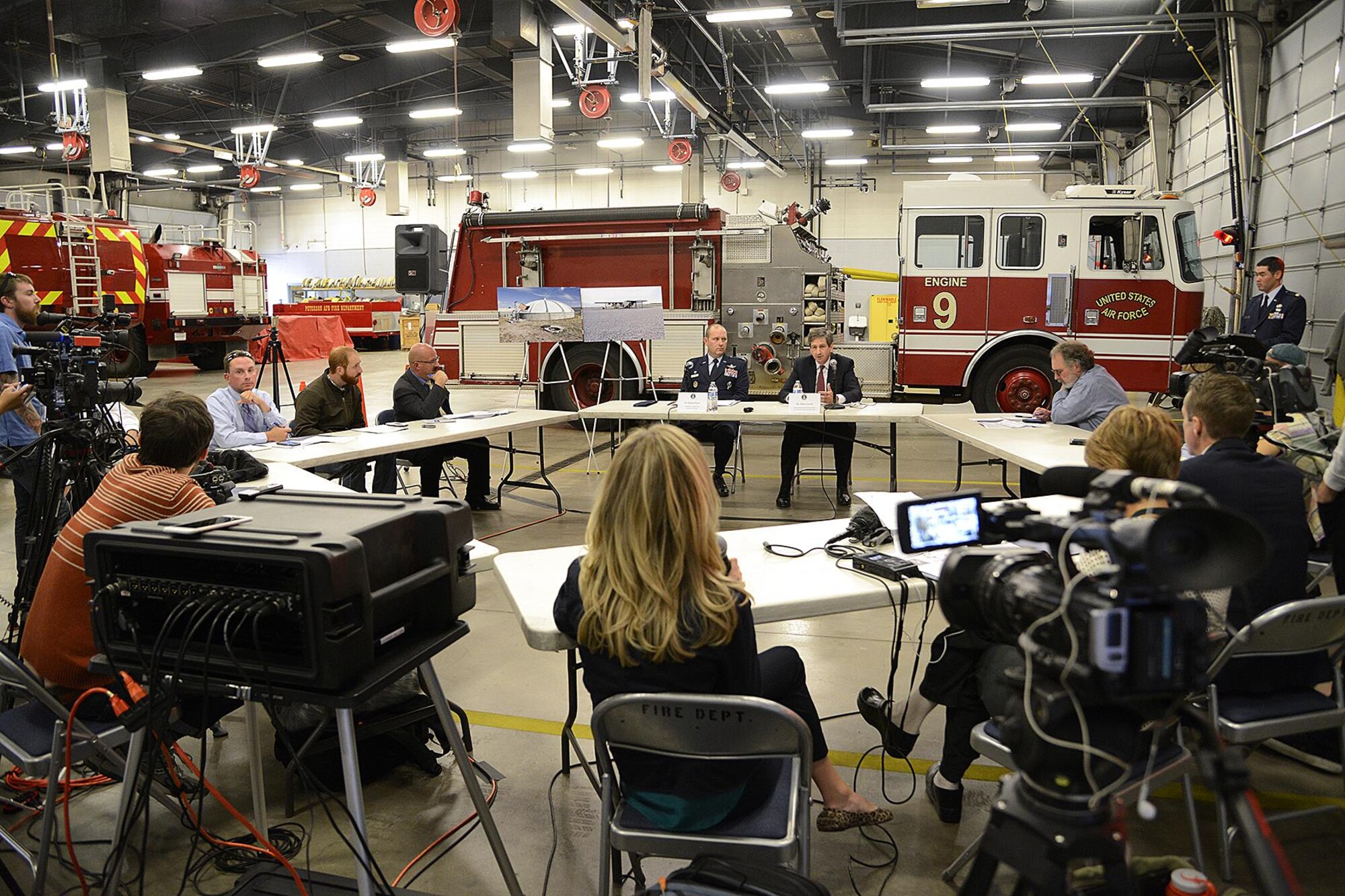 Col Doug Schiess, Commander, 21st Space Wing and Mr. Mark A. Correll , Deputy Assistant Secretary of the Air Force for Environment, Safety and Infrastructure answer questions from the local media at Fire Station One during a media roundtable here on Nov 2, 2016.  Correll and his team were visiting Peterson to discuss the perfluorinated compounds contamination issue in the Fountain, Security, and Widefield communities’ water aquifer. (US Air Force photo by Rob Bussard)
