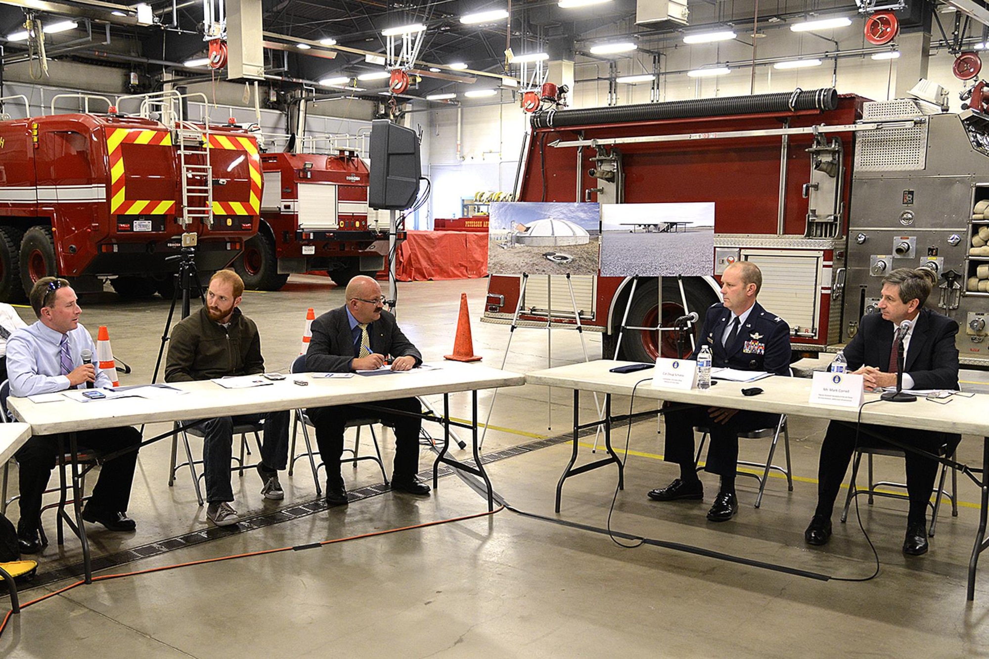 Col Doug Schiess, Commander, 21st Space Wing and Mr. Mark A. Correll , Deputy Assistant Secretary of the Air Force for Environment, Safety and Infrastructure answer questions from the local media at Fire Station One during a media roundtable here on Nov 2, 2016.  Correll and his team were visiting Peterson to discuss the perfluorinated compounds contamination issue in the Fountain, Security, and Widefield communities’ water aquifer. (US Air Force photo by Rob Bussard)