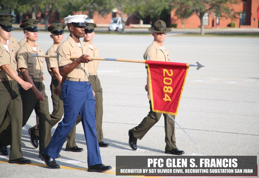 Private First Class Glen S. Francis, honor graduate of platoon 2084, holds his guidon at parade rest before graduation Nov. 4, 2016, aboard Marine Corps Recruit Depot Parris Island, South Carolina. Francis was recruited out of Recruiting Substation San Juan by Sgt. Olivier Civil. (Official Marine Corps photo by Cpl. Diamond N. Peden/Released)