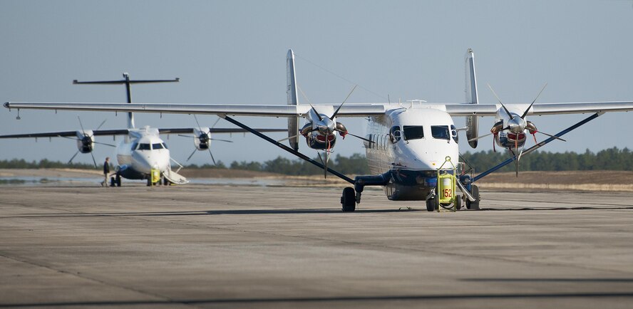 A C-145A Skytruck and a C-146A Wolfhound sit on the flightline waiting for their next mission at Duke Field, Fla.  The two planes are the primary aircraft of the 919th Special Operations Wing. (U.S. Air Force photo/Tech. Sgt. Sam King)  