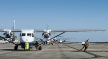 Maintainers with the 919th Special Operations Maintenance Group pull the generator cable and chocks as the aircrew of a C-145A Skytruck prepares for a mission at Duke Field, Fla.  The 919th MXG is responsible for the maintenance of the five Skytrucks in the Air Force fleet.  (U.S. Air Force photo/Tech. Sgt. Sam King)   