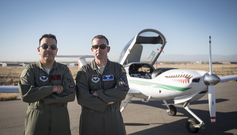 Master Sgts. Alex and Mike, 1st Flying Training Squadron Remotely Piloted Aircraft Initial Flight Training student, pose after completing an Air Force first enlisted solo flight on a Diamond DA-20 at Pueblo Memorial Airport, Pueblo, Colorado Nov. 3, 2016. Today the first enlisted pilot class students took their first solo flight instruction during the 1st FTS training. RPA IFT includes 41 hours of classroom training and 21 hours of pilot training and officer development. (U.S. Air Force digital image by Staff Sgt. Cory Payne)



