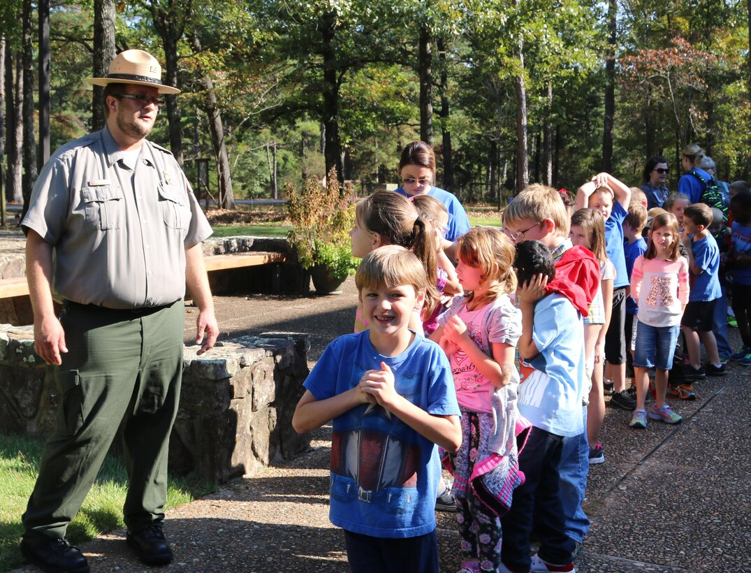 Seth Fisher, natural resource specialist with Little Rock District U.S Army Corps of Engineers conducts a school tour with a group of local children from Heber Springs, Arkansas on October 27.  Fisher is a new employee with the Little Rock District and used his passion of the outdoors for a career in natural resources. The central Arkansas native spend his childhood on his grandparents’ 500 acre farm and knew during his adolescents that he would later grow up and work in nature.