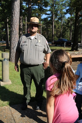 Seth Fisher, natural resource specialist with Little Rock District U.S Army Corps of Engineers conducts a school tour with a group of local children from Heber Springs, Arkansas on October 27.  Fisher is a new employee with the Little Rock District and used his passion of the outdoors for a career in natural resources. The central Arkansas native spend his childhood on his grandparents’ 500 acre farm and knew during his adolescents that he would later grow up and work in nature.