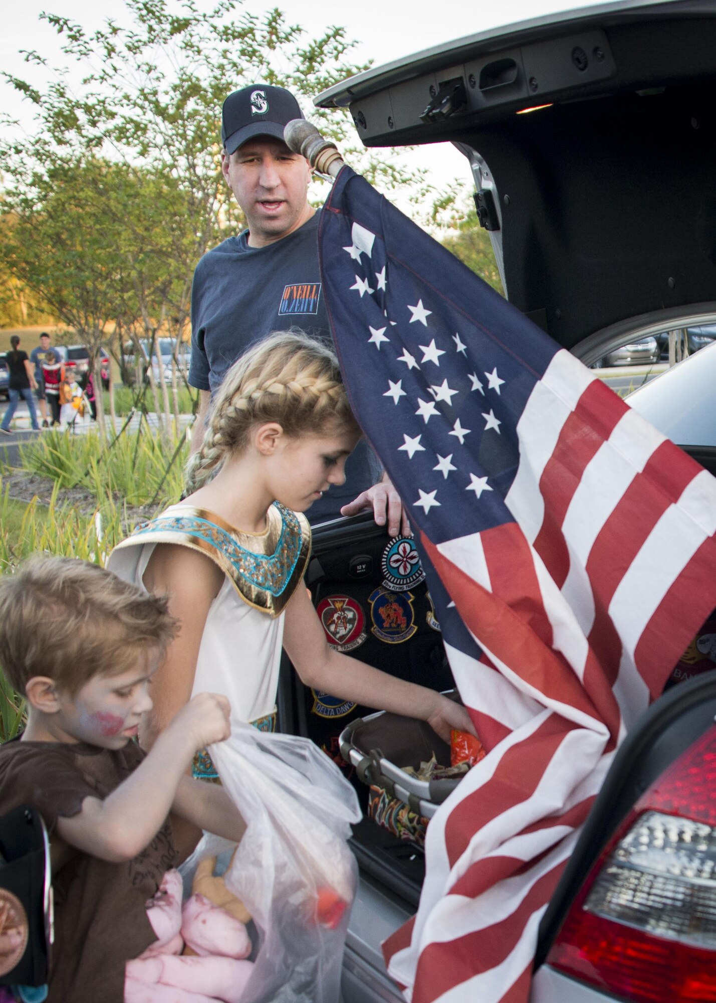 Children pick out a treat during the 919th Special Operations Wing's Trunk or Treat event Oct. 28 at Duke Field, Fla.  More than 100 people attended the annual spooktacular.  (U.S. Air Force photo/Tech. Sgt. Jasmin Taylor)