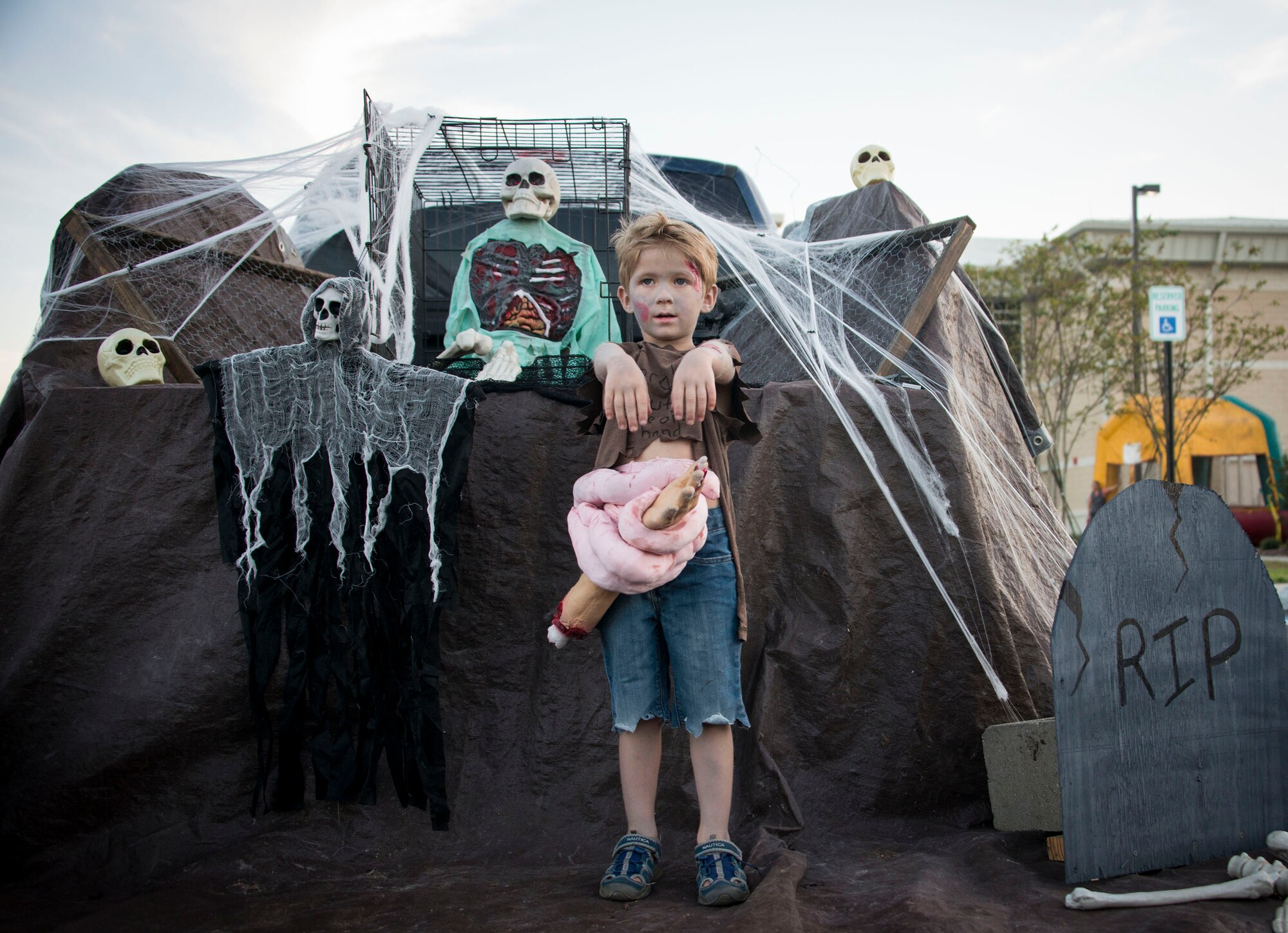 A zombie child waits for his next victim at the 919th Special Operations Wing's Trunk or Treat event Oct. 28 at Duke Field, Fla.  More than 100 people attended the annual spooktacular.  (U.S. Air Force photo/Tech. Sgt. Jasmin Taylor)