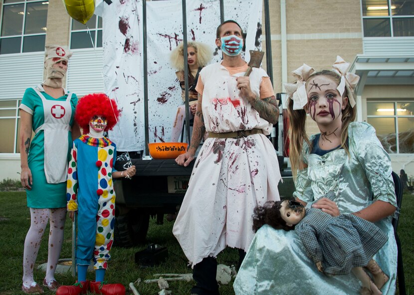 A family of freaks wait for their next victim at the 919th Special Operations Wing's Trunk or Treat event Oct. 28 at Duke Field, Fla.  More than 100 people attended the annual spooktacular.  (U.S. Air Force photo/Tech. Sgt. Jasmin Taylor)