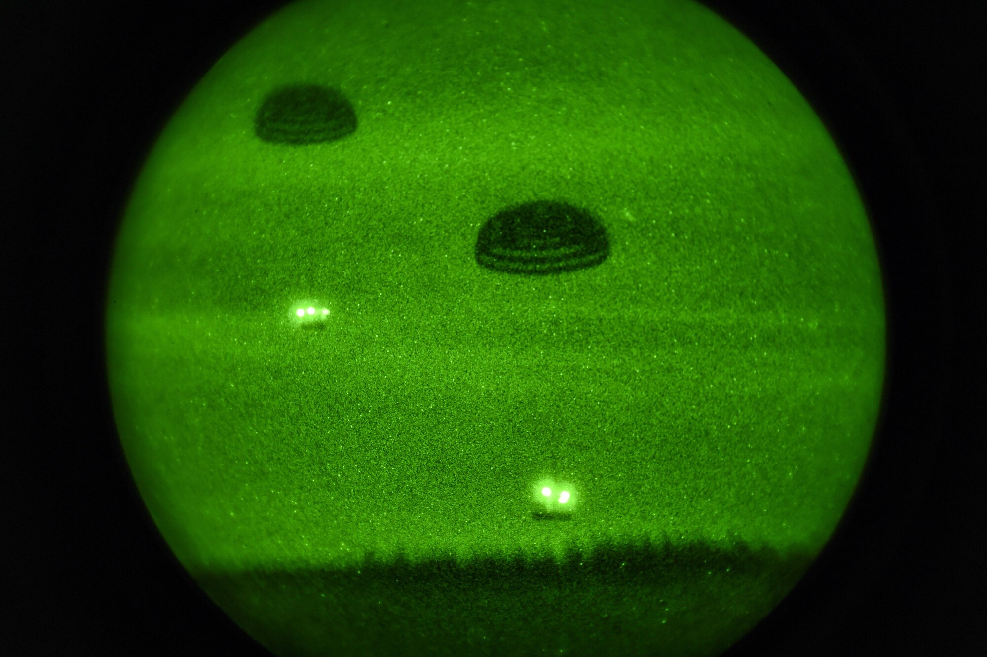 Cargo bundles fall to the ground during Task Force Exercise Southern Strike at Camp Shelby, Miss., Nov. 1, 2016. The bundles were dropped out of an MC-130H Combat Talon II during a training mission. (U.S. Air Force photo by Senior Airman Jeff Parkinson)