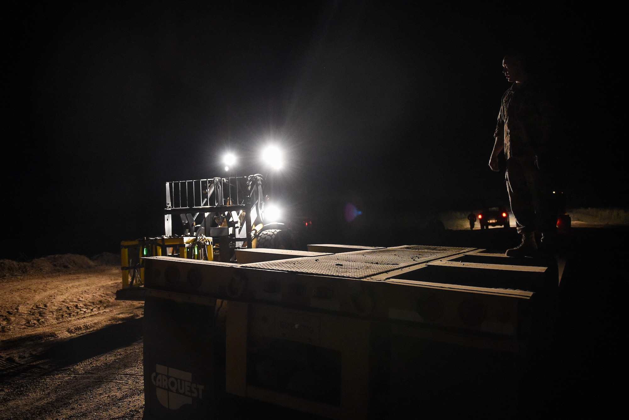Air Commandos move cargo bundles onto a truck during Task Force Exercise Southern Strike at Camp Shelby, Miss., Nov 1, 2016. Southern Strike is a large-scale, conventional and special operations exercise hosted by the Mississippi National Guard at the Gulfport Combat Readiness and Camp Shelby Joint Forces Training Centers. (U.S. Air Force photo by Senior Airman Jeff Parkinson)