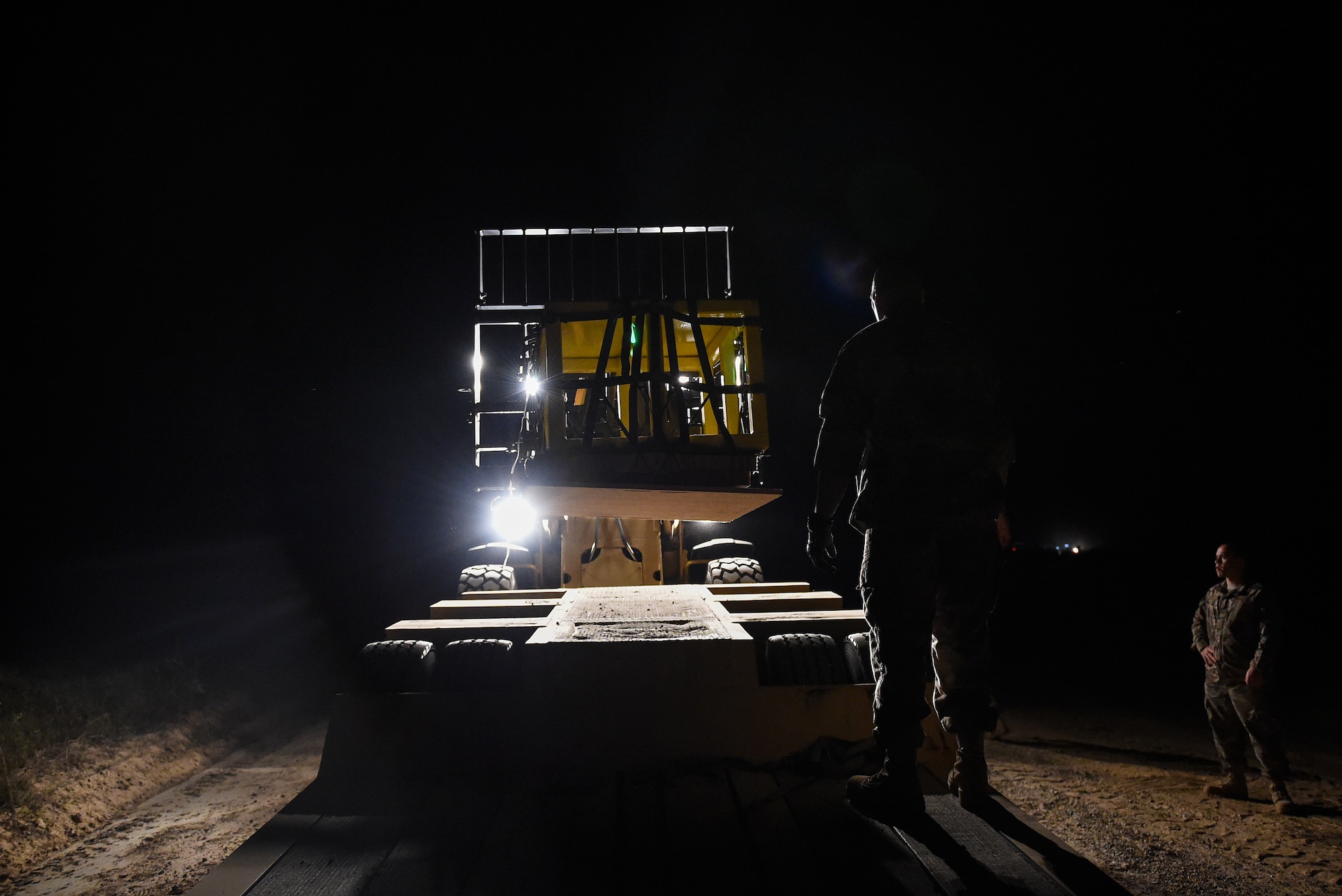 Air Commandos move cargo bundles onto a truck during Task Force Exercise Southern Strike at Camp Shelby, Miss., Nov 1, 2016. Southern Strike is a large-scale, conventional and special operations exercise hosted by the Mississippi National Guard at the Gulfport Combat Readiness and Camp Shelby Joint Forces Training Centers. (U.S. Air Force photo by Senior Airman Jeff Parkinson)