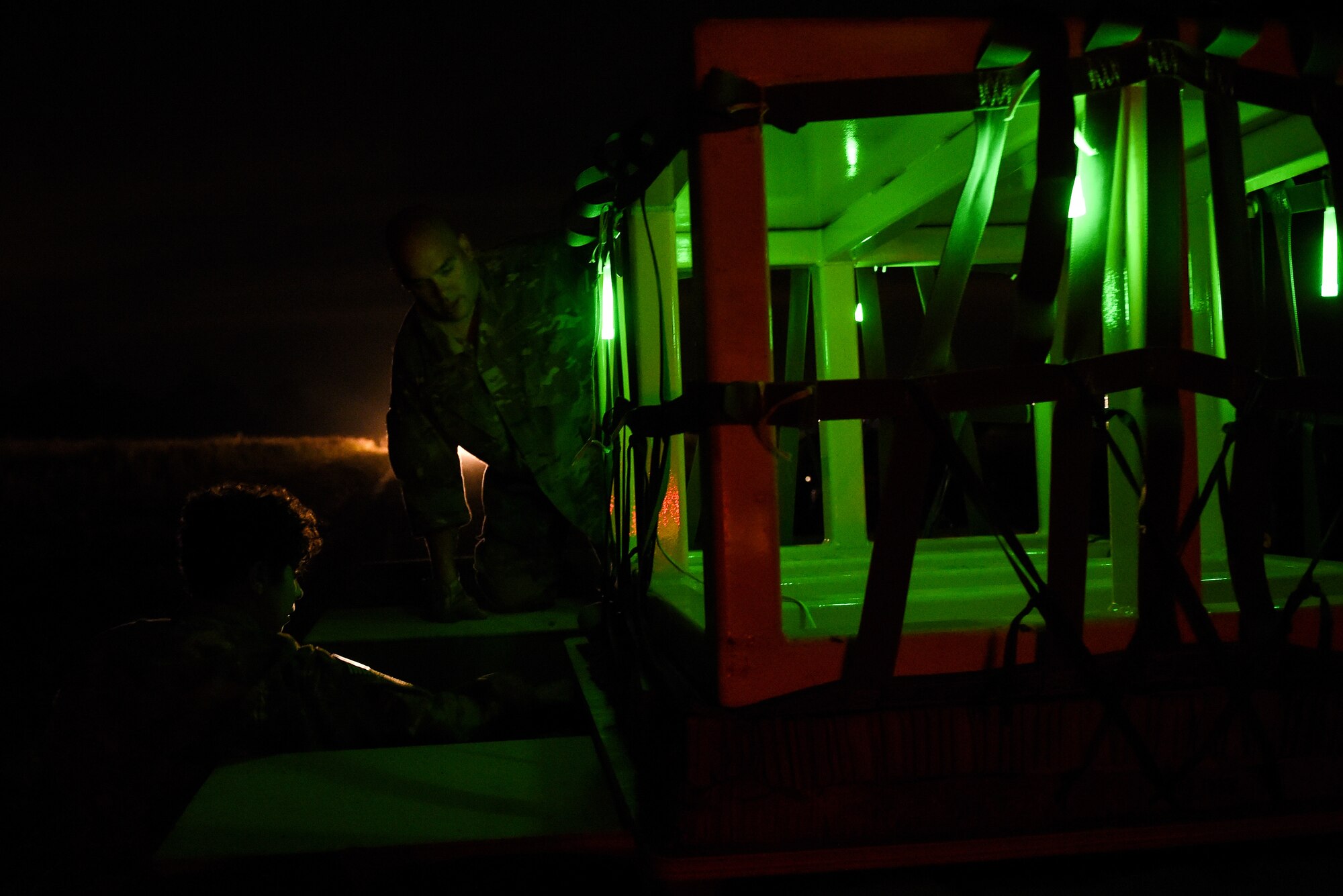 Air Commandos move cargo bundles onto a truck during Task Force Exercise Southern Strike at Camp Shelby, Miss., Nov 1, 2016. Southern Strike is a large-scale, conventional and special operations exercise hosted by the Mississippi National Guard at the Gulfport Combat Readiness and Camp Shelby Joint Forces Training Centers. (U.S. Air Force photo by Senior Airman Jeff Parkinson)
