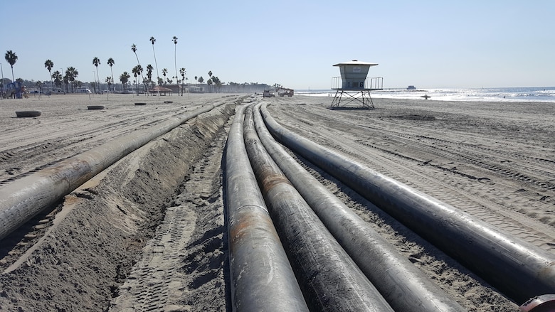 OCEANSIDE, Calif. -- Discharge pipes are lined up and await removal following completion of the Oceanside Harbor navigational dredging project. The project removed sediment from the harbor's entrance channel and placed nearly 260,000 cubic yards of material along the beach between the San Luis Rey River outlet and the Oceanside Pier.
