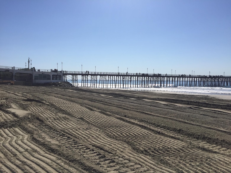 Upon conclusion of the Oceanside Harbor navigational dredging project that placed nearly 260,000 cubic yards of material along the city's shoreline, the contractor removed the discharge pipe and other equipment and graded the beach.