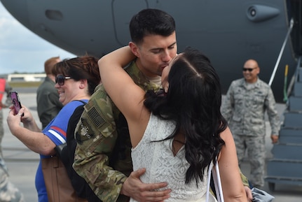 Staff Sgt. Theodore Clever III, of the 15th Airlift Squadron, 437th Airlift Wing, kisses his wife upon returning home from a deployment to Southwest Asia Nov. 2, 2016, at Joint Base Charleston, South Carolina. Members of the 14th and 16th Airlift Squadrons returned as well. The 437th AW commands the base's premier active-duty flying wing. The wing flies and maintains one of the largest fleets of C-17 aircraft in the Air Force, providing a significant portion of Air Mobility Command’s Global Reach airlift capability. 