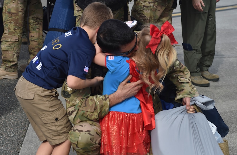 Staff Sgt. Theodore Clever III, of the 15th Airlift Squadron, 437th Airlift Wing, reunites with his children upon returning home from a deployment to southwest Asia Nov. 2, 2016, at Joint Base Charleston, South Carolina. Members of the 14th and 16th Airlift Squadrons returned as well. The 437th AW commands the base's premier active-duty flying wing. The wing flies and maintains one of the largest fleets of C-17 aircraft in the Air Force, providing a significant portion of Air Mobility Command’s Global Reach airlift capability. 