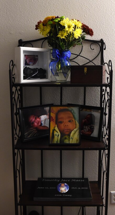 U.S. Air Force Tech. Sgt. Jeff Maese, 489th Maintenance Squadron aerospace propulsion craftsman, and his wife have a memorial set up in their living room for their son, Timothy Jace Maese, who passed away to multiple medical conditions. The memorial is made up of fresh flowers, photographs, Timothy’s ashes and his headstone until they find a forever home and decide to bury him close to where they will always be. (U.S. Air Force photo by Senior Airman Shannon Hall)