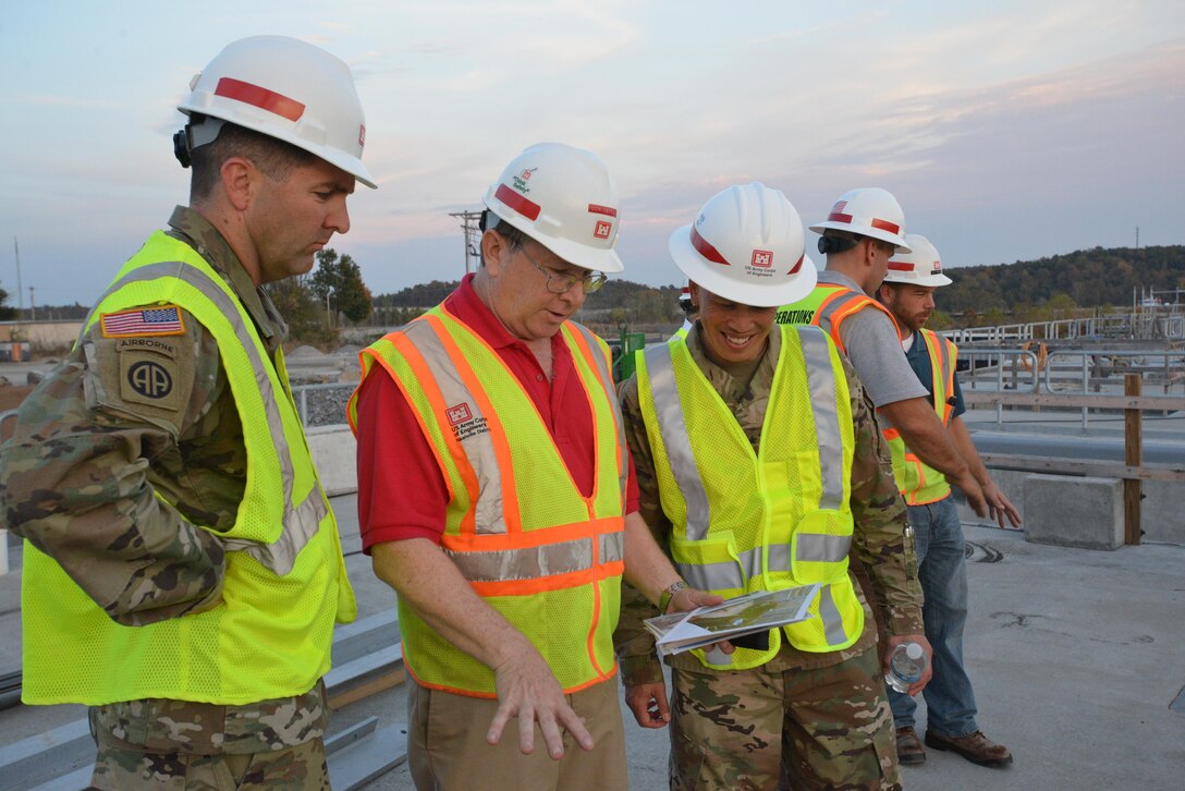 Lt. Col. Stephen Murphy, Nashville District commander listens as Don Getty, Kentucky Lock Addition Project project manager, explains construction to Brig. Gen. Mark Toy, U.S. Army Corps of Engineers Great Lakes and Ohio River Division commander, on the construction site in Grand Rivers, Ky., Nov. 2, 2016. 