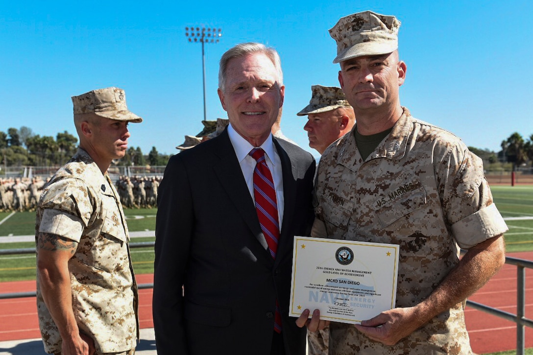 161019-N-AC887-003
Col. William Pitman accepts an award from Secretary of the Navy Ray Mabus on behalf of Marine Corps Recruit Depot San Diego at Marine Corps Base Camp Pendleton, Calif., Oct. 19, 2016. The Secretary of the Navy Energy and Water Management Awards recognize those Marines, Sailors and civilian employees whose ingenuity and dedication led the way to achieving energy goals and helped change the way the Services think about and use power. (U.S. Navy photo by Chief Petty Officer Sam Shavers)