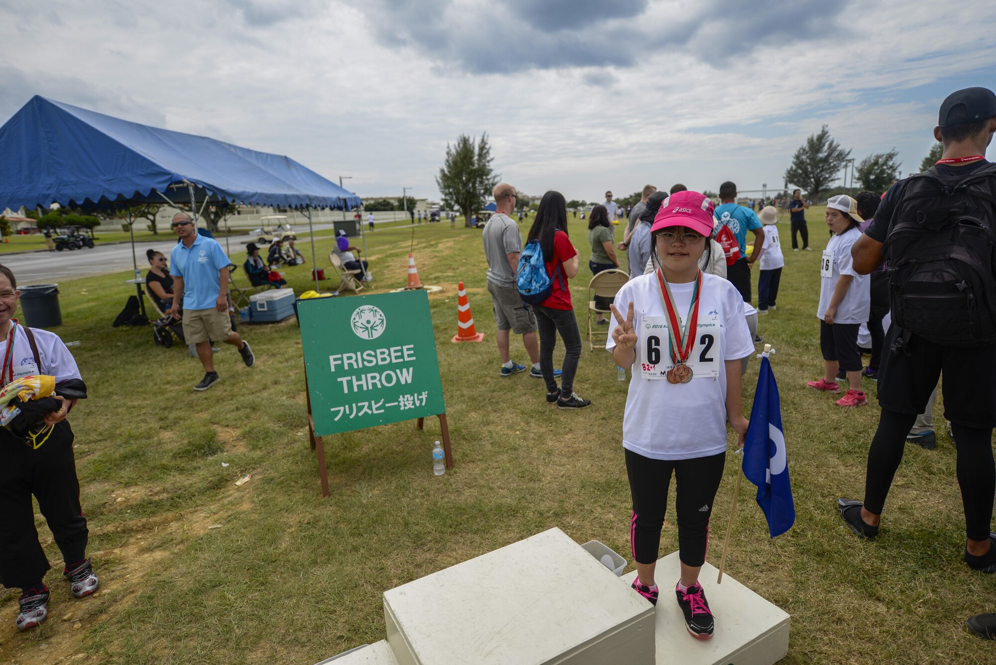 A Kadena Special Olympic athlete stands on the winner’s podium after taking third place in the Frisbee toss challenge Nov. 5, 2016 during the Kadena Special Olympics, at Kadena Air Base, Japan. This year marks the 17th annual KSO, a sporting event dedicated to enriching the lives of special-needs individuals while strengthening U.S.-Okinawa relationships. (U.S. Air Force photo by Senior Airman Stephen G. Eigel/released)