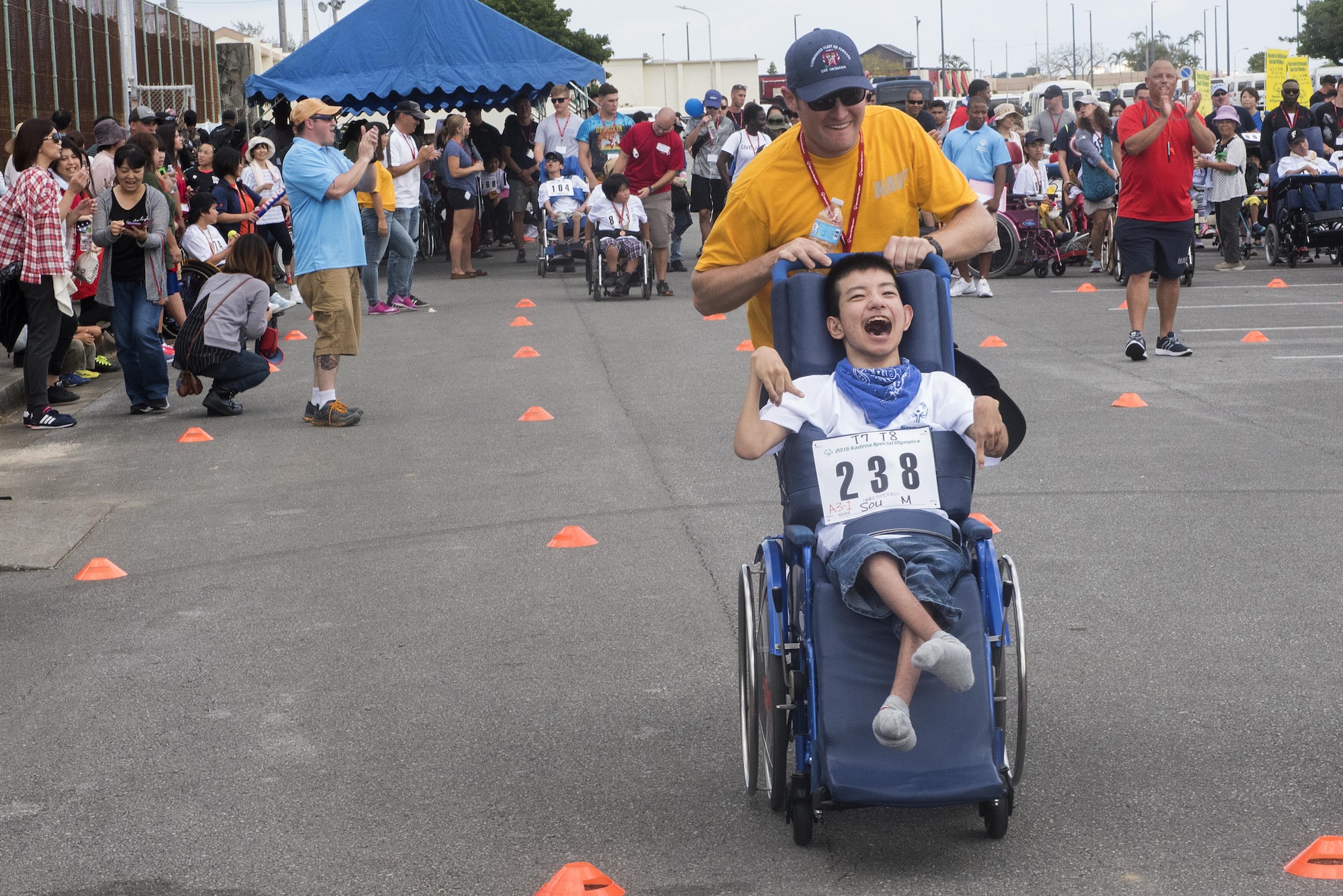 Sou Miyagi, Kadena Special Olympics athlete, races other athletes in the wheelchair dash Nov. 5, 2016, at Kadena Air Base, Japan. The Special Olympics is the world's largest sports organization for people with intellectual disabilities and the 17th annual KSO transforms the lives of nearly 900 athletes through the joy of sport on their special day. (U.S. Air Force photo by Airman 1st Class Corey M. Pettis/Released)