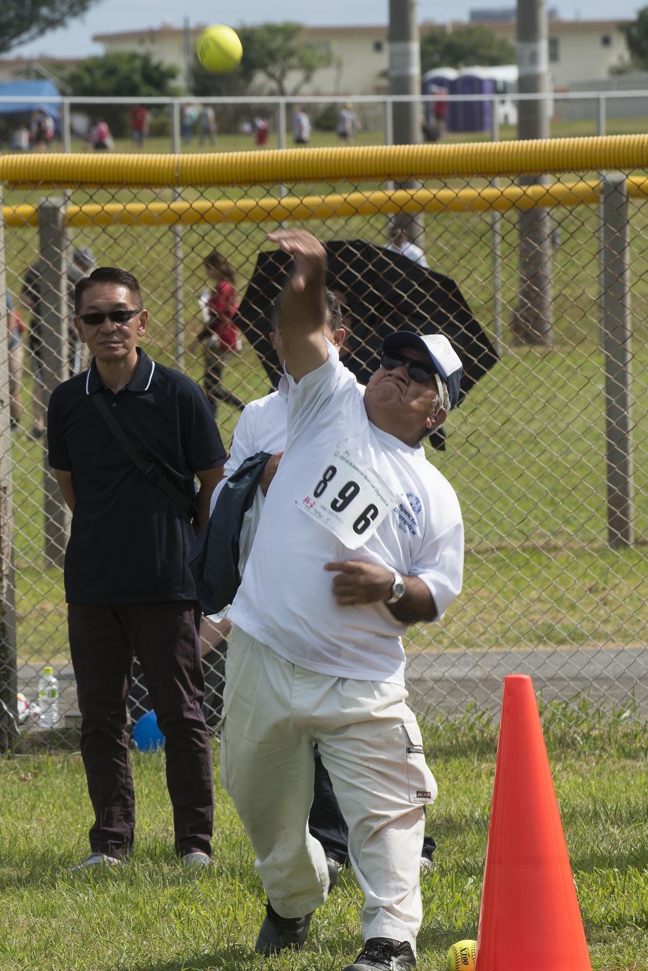 Tetsu Taira, Kadena Special Olympics athlete, throws a softball Nov. 5, 2016, at Kadena Air Base, Japan. Established by the 18th Wing commander in 2000, KSO is a sporting and outreach event providing opportunities for all communities involved to stand together in support of people with special needs. (U.S. Air Force photo by Airman 1st Class Corey M. Pettis/Released)